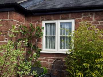 WILLASTON SOUTH WIRRAL: Installation of Evolution Storm Windows. Whitewood cottage style. Double glazed U value 1.6 pvcu sliding sash window frames cheshire